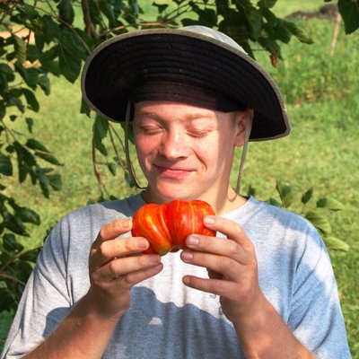 Craig admiring a tomato during a 2006 harvest. 