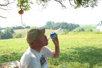 Staff member drinking water in the August of 2005.