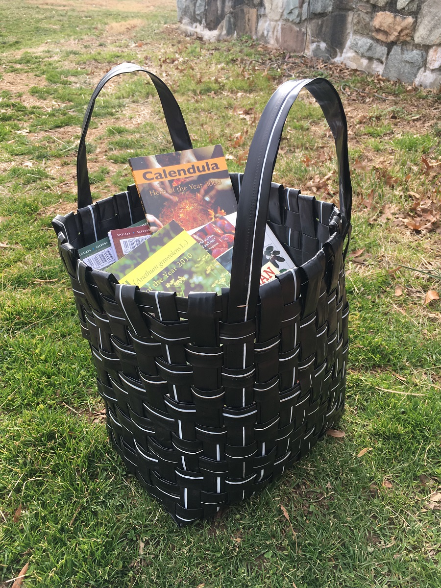 A finished drip tape bag filled with books. Available for purchase staring in spring!